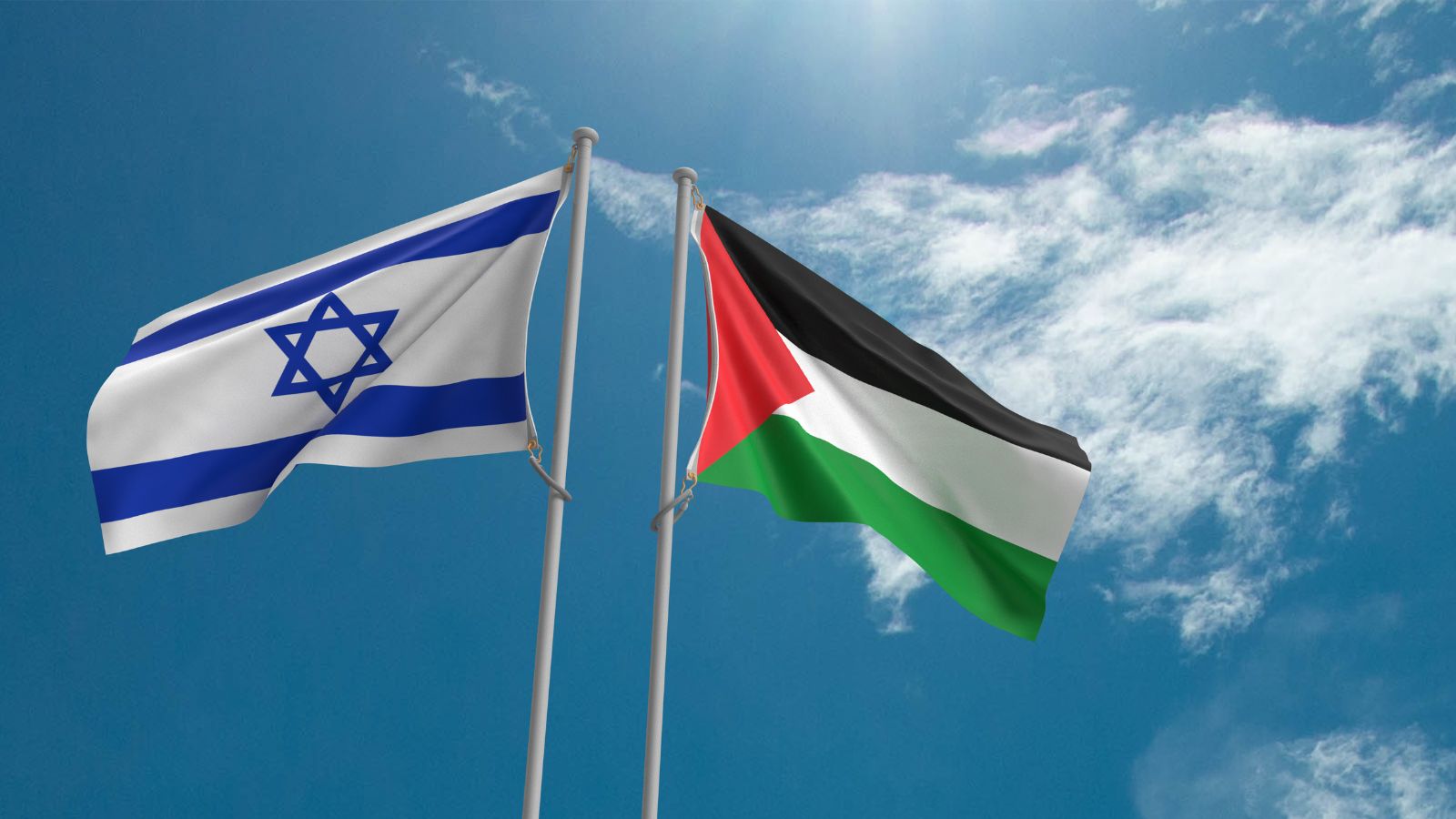 Eine isralische und eine palästinensische Flagge wehen im Wind.